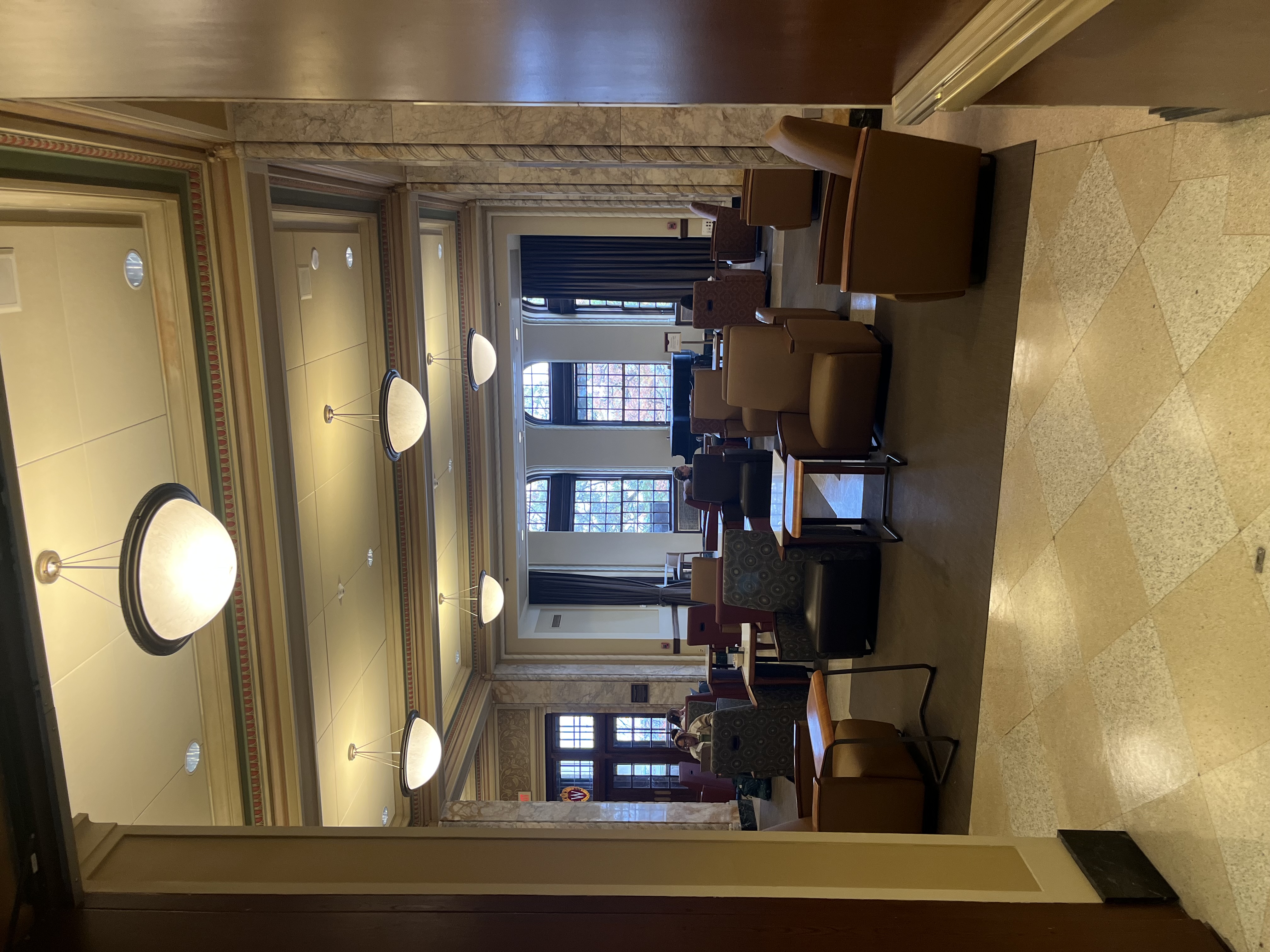 Upstairs room in Memorial Union showing many students studying.